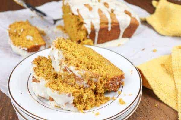 Pumpkin bread with maple cream icing is an easy pumpkin bread recipe. It's the perfect dessert for the fall season with plenty of cinnamon, nutmeg, ginger, and fall spices.