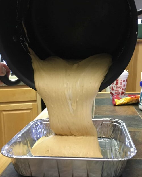 Peanut Butter Fudge being poured into a container