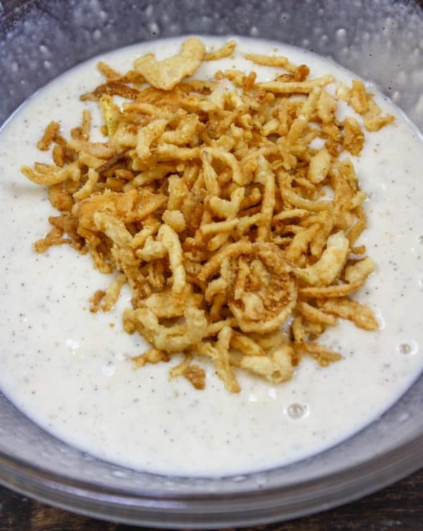 Picture of crispy fried onions on top of mushroom soup