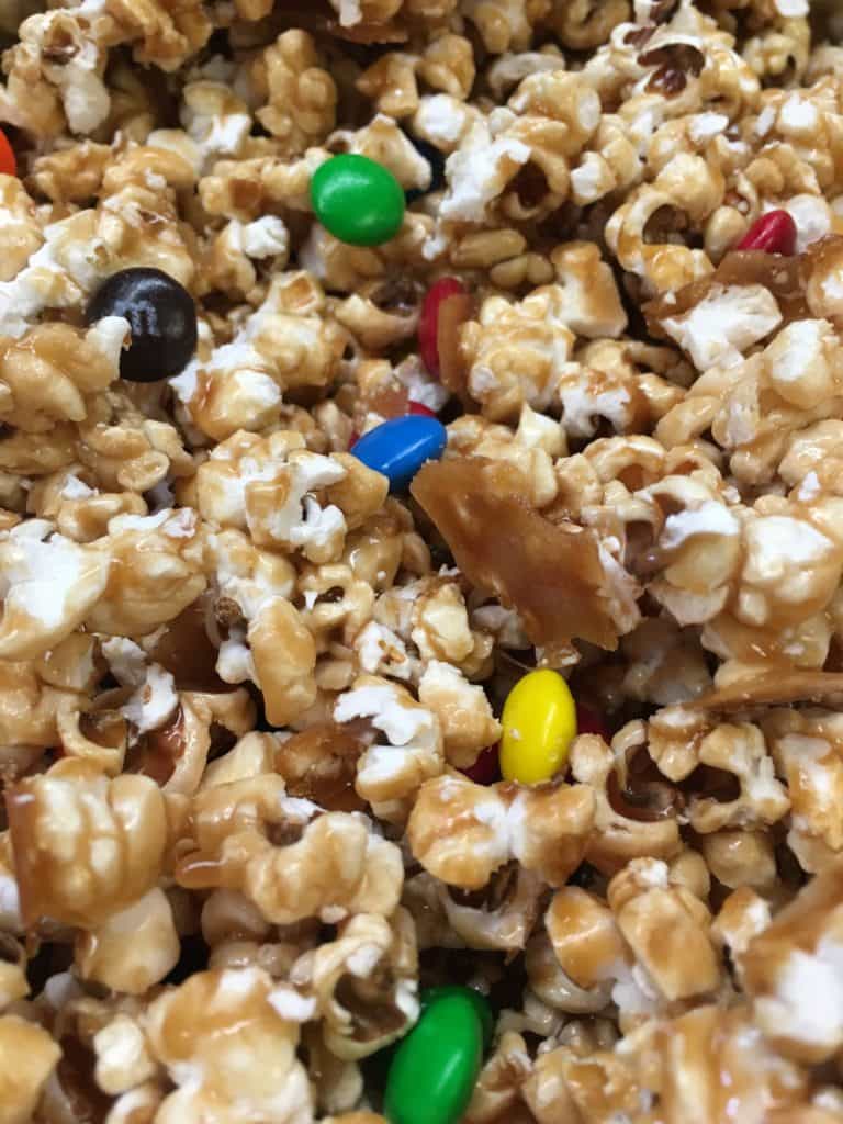 Homemade Salted Caramel Popcorn is a great snack for football parties, Valentine's Day gifts, teacher gifts, and just plain ole' good snacks.