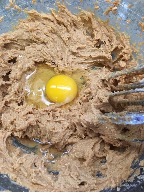 Picture of peanut butter cookie dough with an egg