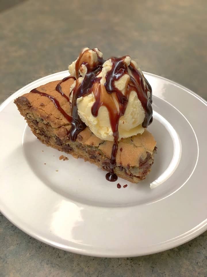 Create a giant chocolate cookie in a cast iron skillet is so easy to make. Mix the ingredients and scoop them into the skillet, and you'll have a delicious treat in no time.