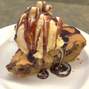 Create a giant chocolate cookie in a cast iron skillet is so easy to make. Mix the ingredients and scoop them into the skillet, and you'll have a delicious treat in no time. 