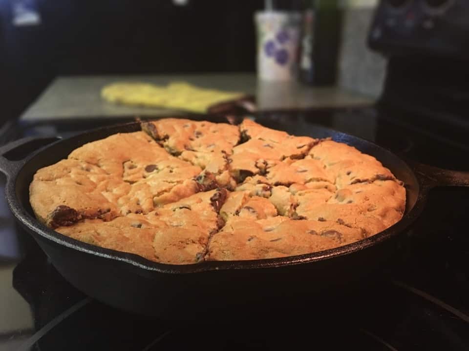 Create a giant chocolate cookie in a cast iron skillet is so easy to make. Mix the ingredients and scoop them into the skillet, and you'll have a delicious treat in no time.