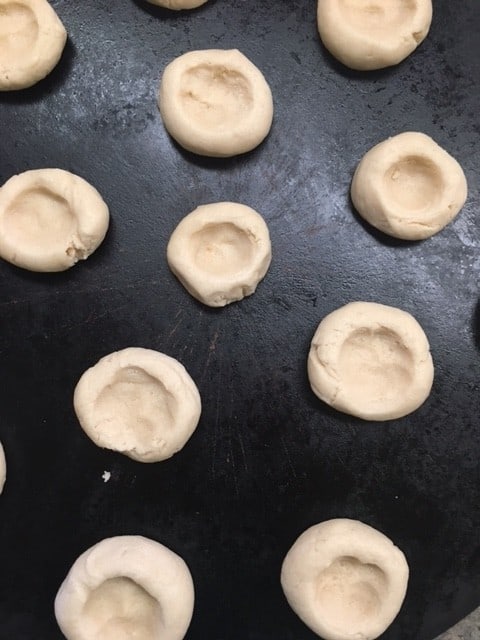 I love Twix candy bars, and I love these easy shortbread Twix Thumbprint Cookies. They taste just like the candy bar and are super easy to make.