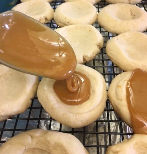 I love Twix candy bars, and I love these easy shortbread Twix Thumbprint Cookies. They taste just like the candy bar and are super easy to make.