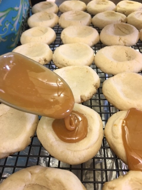 I love Twix candy bars, and I love these easy shortbread Twix Thumbprint Cookies. They taste just like the candy bar and are super easy to make.