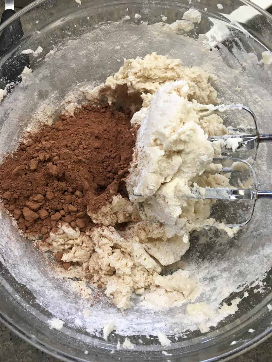 Chocolate Drop Powdered Cookies are a great holiday dessert recipe. They are easy to make and you will have plenty to take to all of your holiday parties.