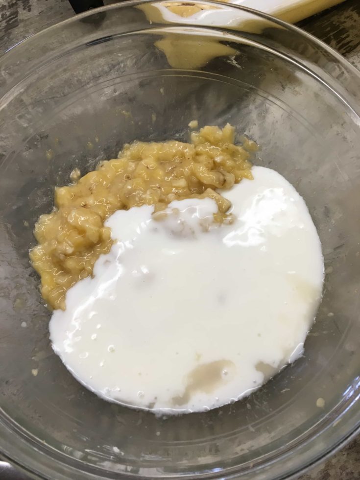 Buttermilk and mashed bananas in a bowl