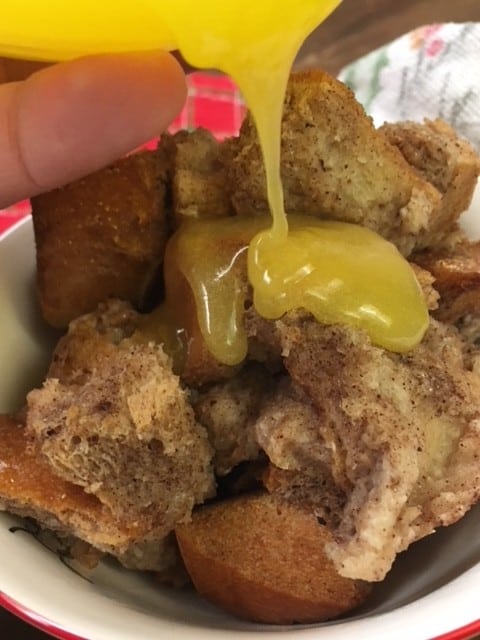 Cinnamon Spiced Bread Pudding with Butter Sauce is an easy and cheap treat for the Christmas holiday. I love the spice-filled taste with the creamy sauce.