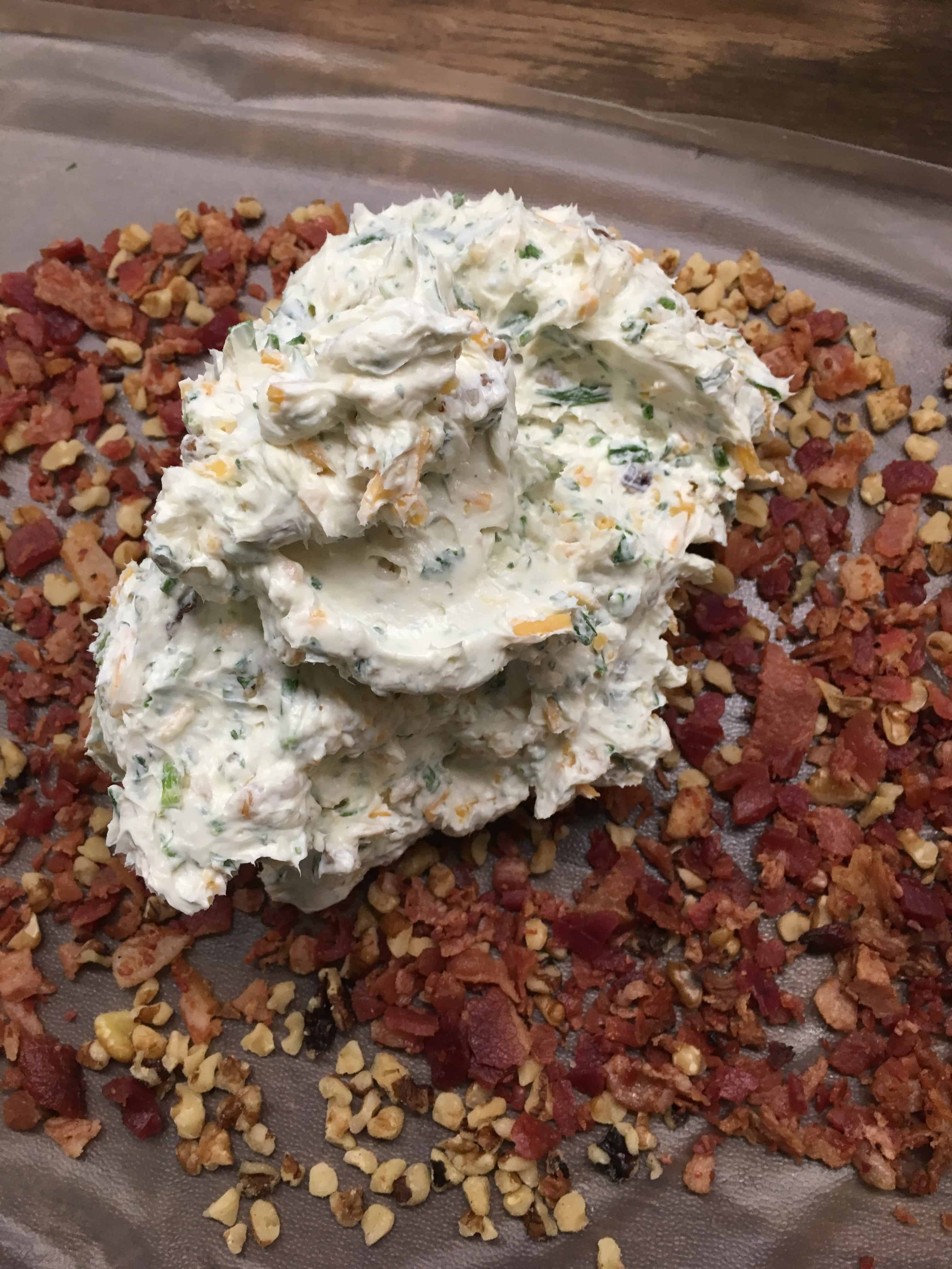 Easy Holiday Bacon Ranch and Walnut Cheeseball is a classic holiday appetizer. The cheeseball is the perfect food to bring to any party. I use pre made real bacon to make it quick and get it ready to eat.