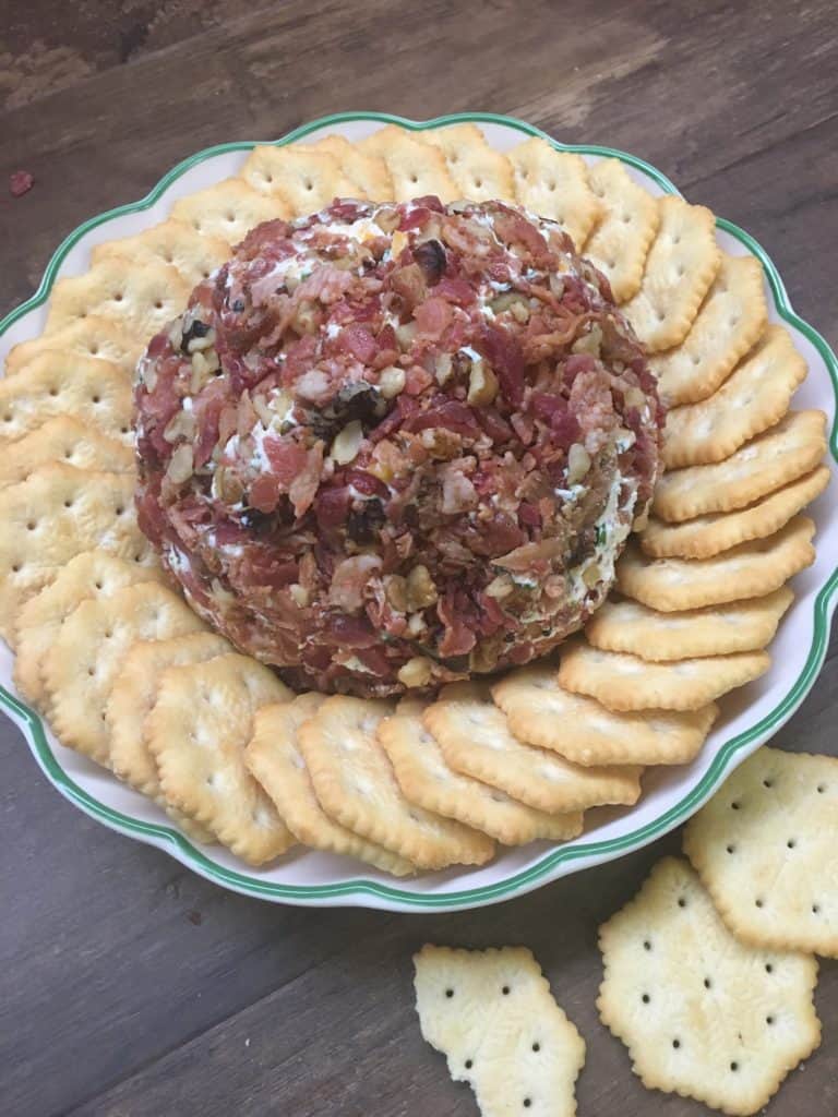 Easy Holiday Bacon Ranch and Walnut Cheeseball is a classic holiday appetizer. The cheeseball is the perfect food to bring to any party. I use pre made real bacon to make it quick and get it ready to eat.