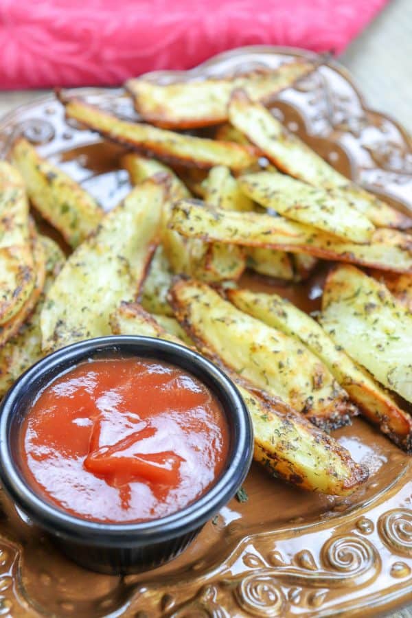 Picture of potato wedges and ketchup.