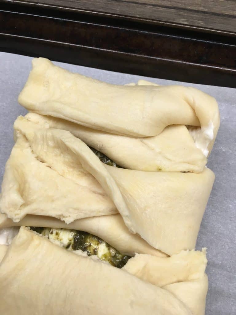 The Cream Cheese Pesto Crescent Roll Braid is a delicious appetizer to make for parties. 