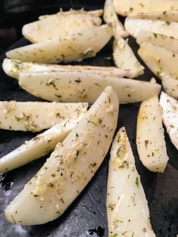 Oven Baked Potato Wedges recipe is a delicious and easy side dish to fix. The seasoned oven baked potato wedges recipe is perfect for supper or as an appetizer for football games, parties, and as a snack.