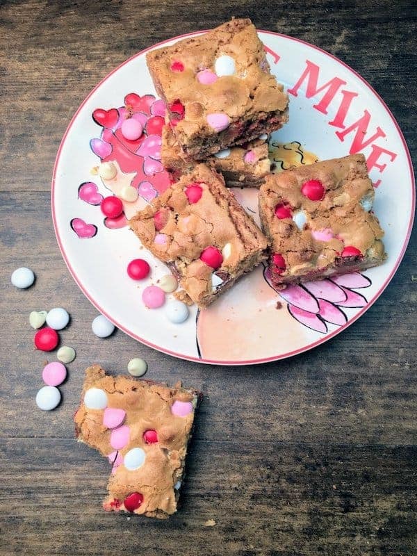 It's Valentine's Day and these blondies are easy to make and the perfect gift for your loved ones. The Valentine's Day Blondie Dessert Recipe is a favorite here at our house and makes the perfect gift for teachers, friends, and loved ones. Be sure to grab the recipe for the Valentine's Day Blondies.