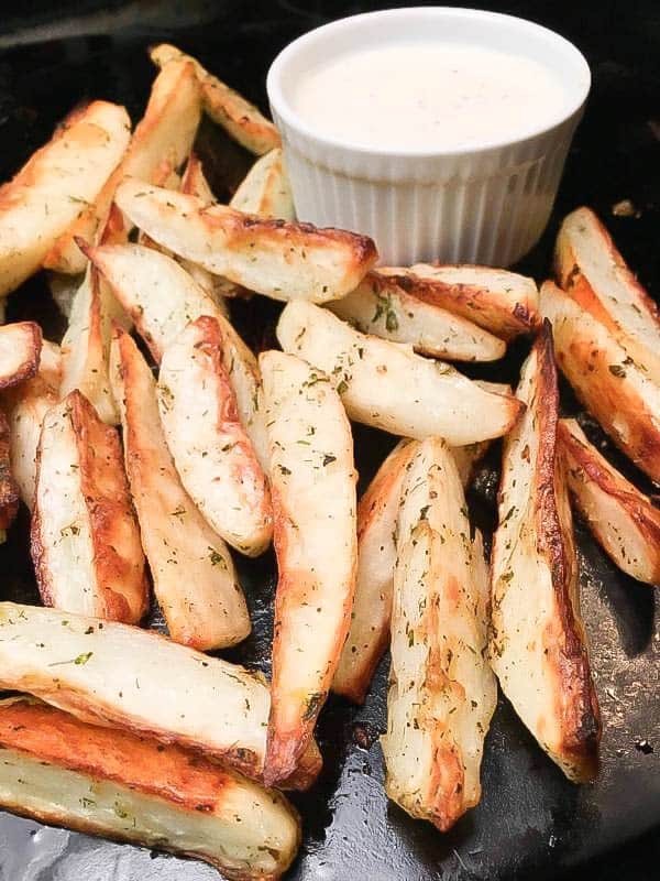 Oven Baked Potato Wedges recipe is a delicious and easy side dish to fix. The seasoned oven baked potato wedges recipe is perfect for supper or as an appetizer for football games, parties, and as a snack.