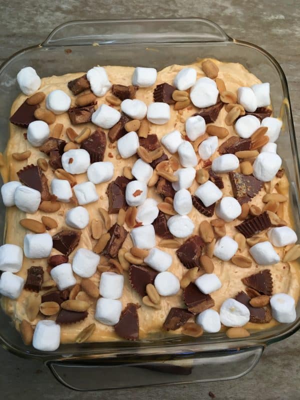 Reese's Peanut Butter Pudding Dessert is the perfect recipe for any gathering. The peanut butter cup dessert is filled with pudding, marshmallows, peanuts, graham crackers, and chocolate syrup. The recipe is a delicious treat that everyone will love.