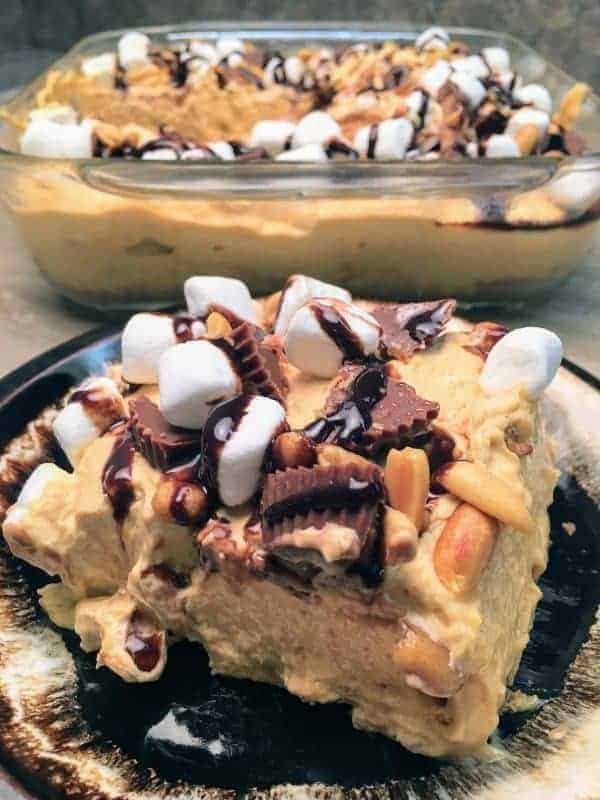 Reese's Peanut Butter Pudding Dessert is the perfect recipe for any gathering. The peanut butter cup dessert is filled with pudding, marshmallows, peanuts, graham crackers, and chocolate syrup. The recipe is a delicious treat that everyone will love.