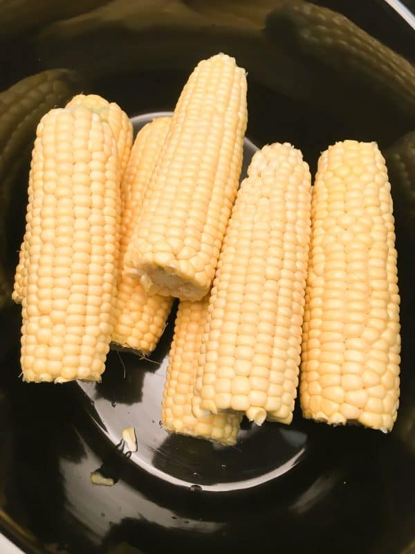 Crock Pot Corn on the Cob with Coconut Milk is an easy recipe. The coconut milk and butter give the corn and soft and buttery taste. The budget-friendly side dish comes out perfect in the slow cooker.