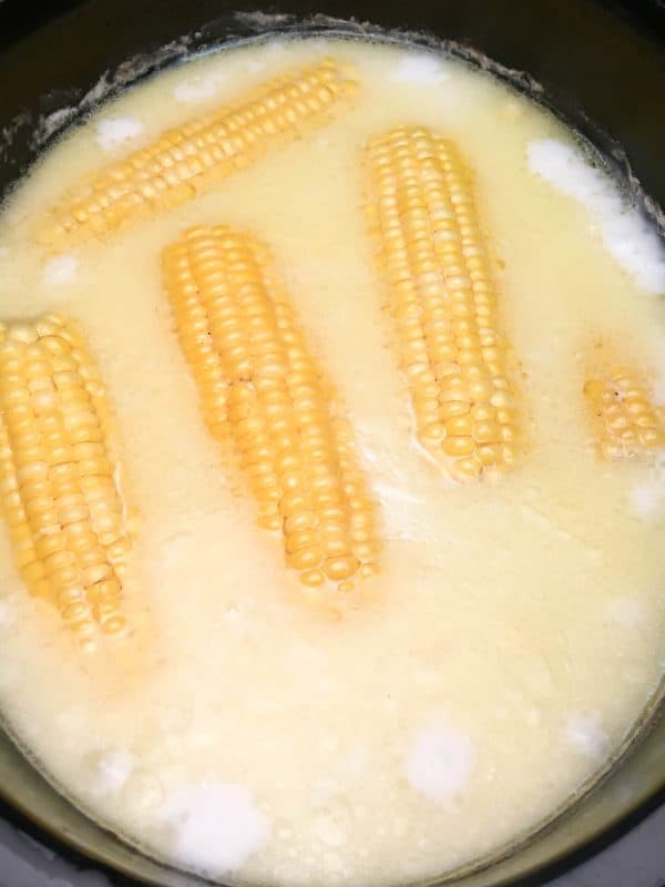 Crock Pot Corn on the Cob with Coconut Milk is an easy recipe. The coconut milk and butter give the corn and soft and buttery taste. The budget-friendly side dish comes out perfect in the slow cooker.