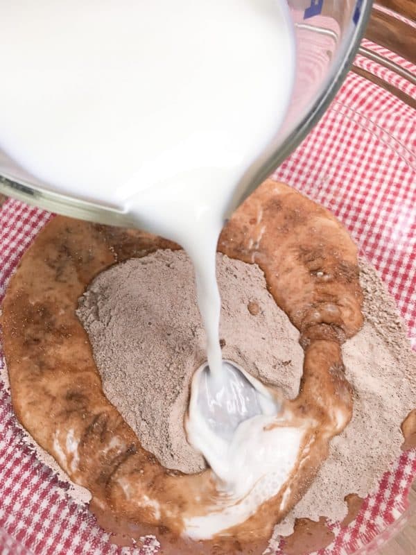 Chocolate layer dessert with a graham cracker crust, homemade whipped cream, chocolate pudding, and cream cheese is a delicious recipe. The easy recipe is the perfect dish for a party, the holidays, or for dessert at home.