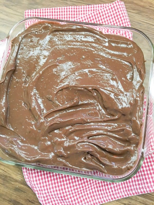 Chocolate layer dessert with a graham cracker crust, homemade whipped cream, chocolate pudding, and cream cheese is a delicious recipe. The easy recipe is the perfect dish for a party, the holidays, or for dessert at home.