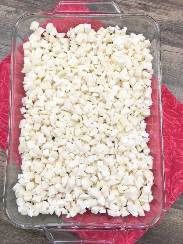 Diced potatoes in a large casserole dish.