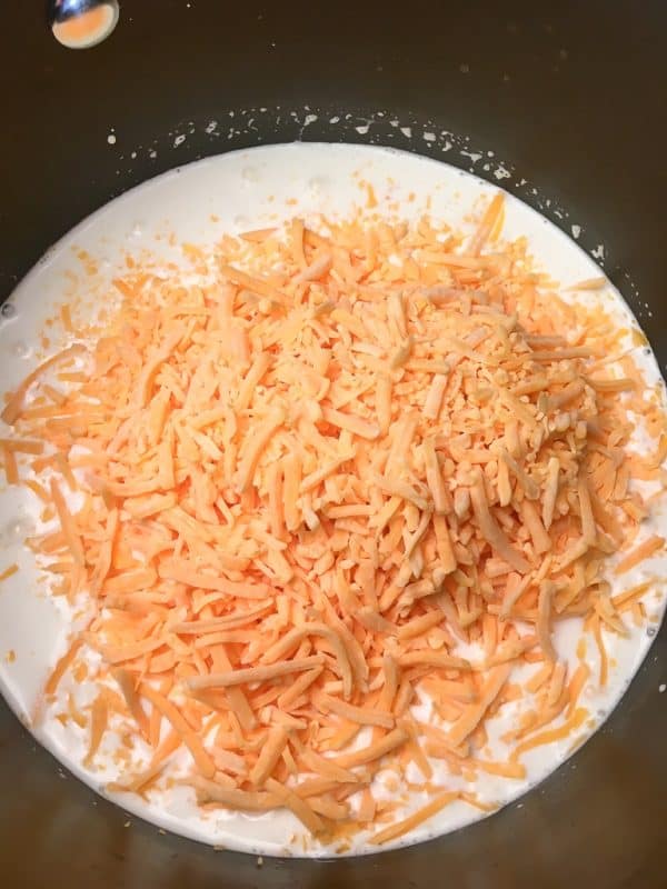 Shredded cheese in a saucepan