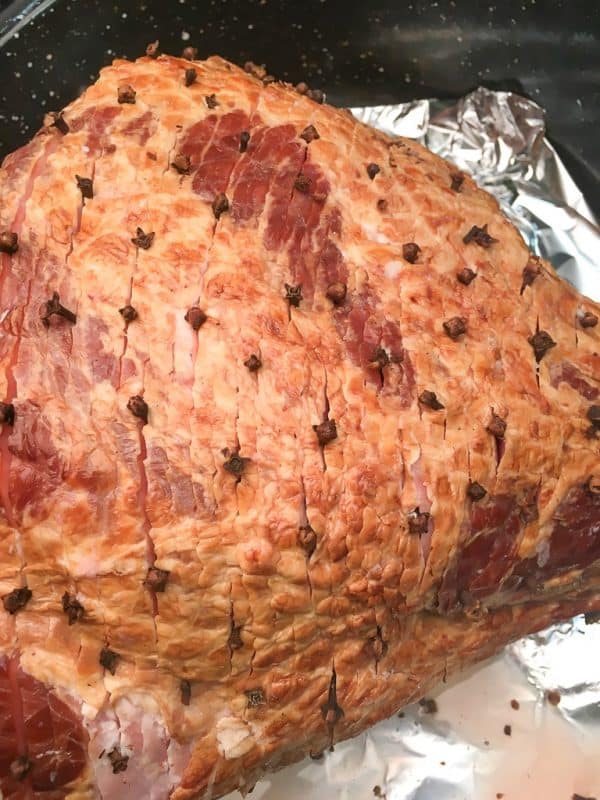 Baked Ham with Brown Sugar Glaze is a delicious and easy recipe for any holiday including Easter, Christmas, and Thanksgiving.