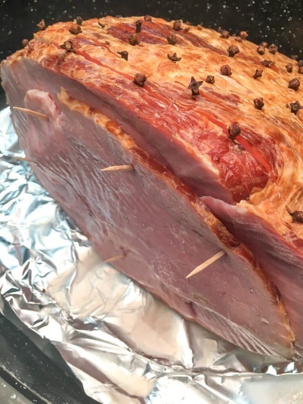 Baked Ham with Brown Sugar Glaze is a delicious and easy recipe for any holiday including Easter, Christmas, and Thanksgiving.