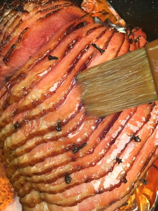 Baked Ham with Brown Sugar Glaze is a delicious and easy recipe for any holiday including Easter, Christmas, and Thanksgiving.