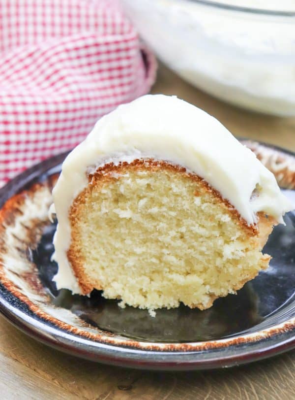 Picture of pound cake on a plate with cream cheese frosting