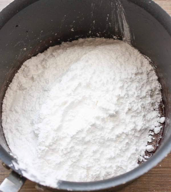 Powdered sugar makes up a delicious chocolate frosting for cakes. 