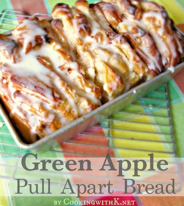 Picture of pull apart apple bread on a colorful tablecloth