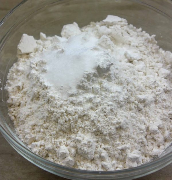 Picture of flour in a glass bowl.