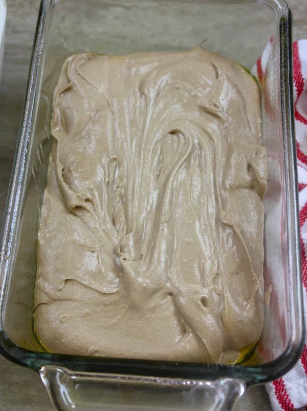 Picture of pound cake batter in a glass bread pan.