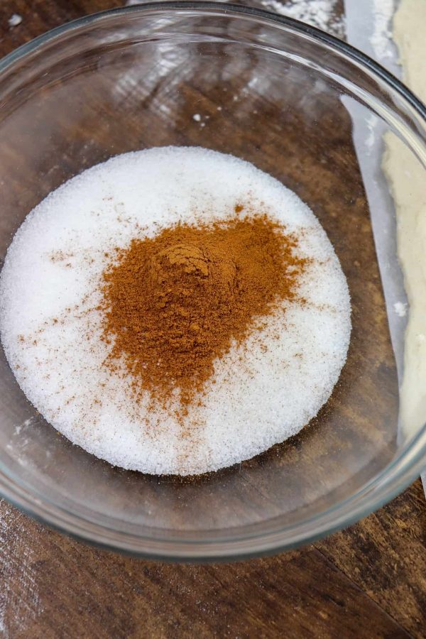 Picture of cinnamon and sugar in a glass bowl.