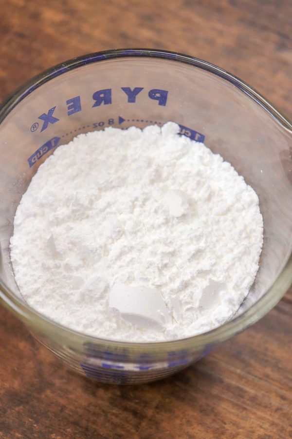 Picture of powdered sugar in a mixing cup.