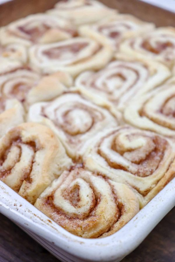 Picture of baked cinnamon rolls in a casserole dish.