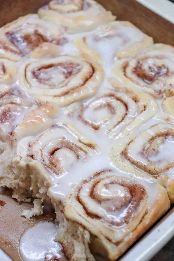 Picture of cinnamon rolls in a baking dish with icing.