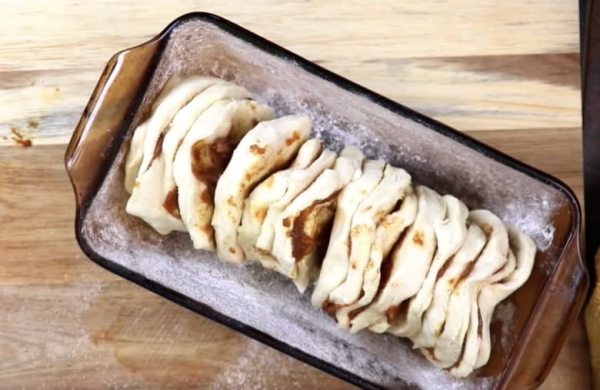 Picture of pumpkin pull apart bread in a glass bread dish.