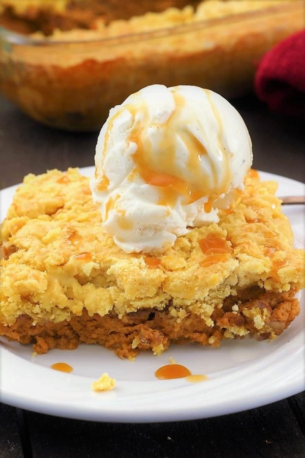 Picture of pumpkin pie cake with a scoop of ice cream on top