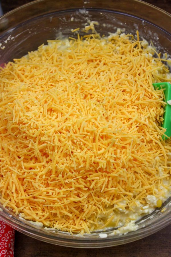 Picture of shredded cheese in a bowl with corn.