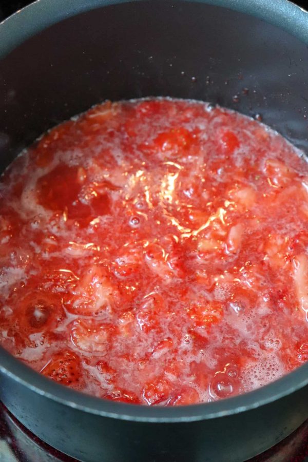 Picture of strawberries boiling in a saucepan. 