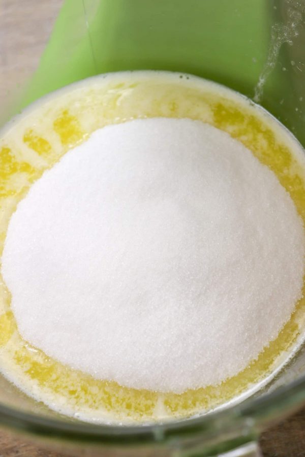 Picture of butter and sugar in a mixing bowl. 