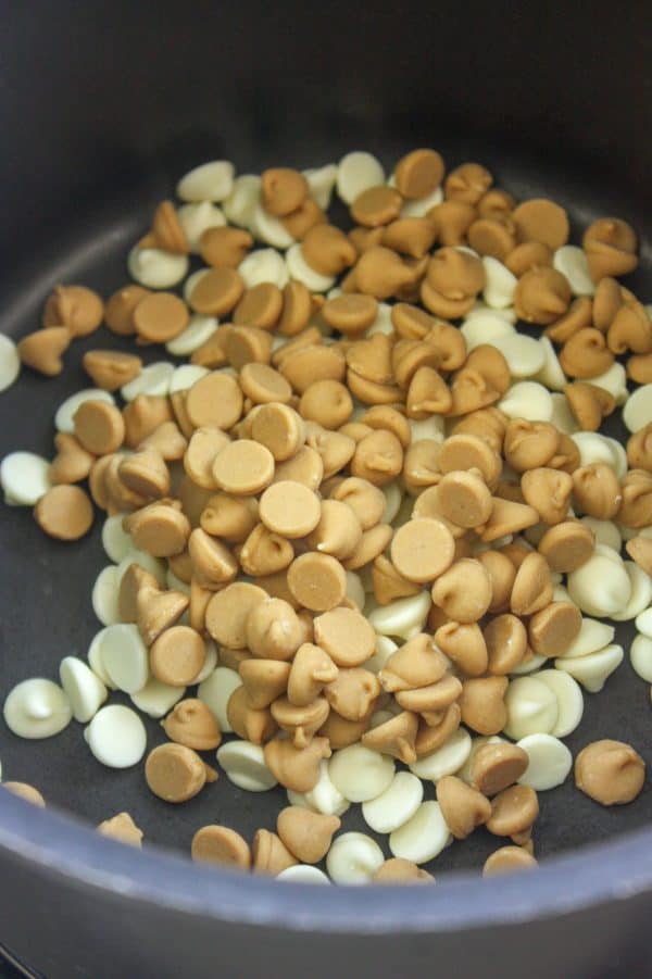 Picture of butterscotch and white chocolate chips in a saucepan.