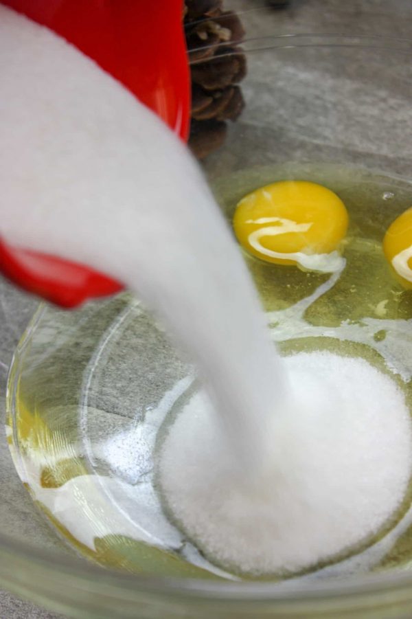 Picture of sugar being poured into a bowl