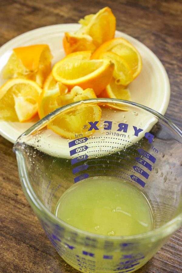 Picture of pineapple juice with orange slices.