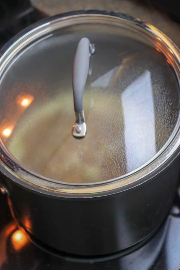 Picture of a lid on a saucepan with soup